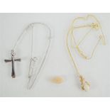 A 9ct white gold necklace and crucifix pendant together with a 9ct opal pendant and necklace and a