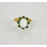 A 9ct gold, opal and emerald flowerhead ring, 3.36g.