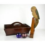 A Victorian cutlery tray, a nodding painted treen parrot on perch, and two glass balls.
