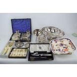 A group of silver plate ware including candlesticks, ladle basket, a Masons bowl, silver salt and