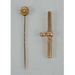 A 9ct gold fob (unmarked), and hat pin with diamond set starburst, 3.46g total