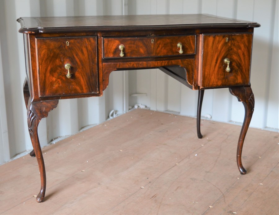 A 20th century mahogany lowboy