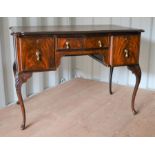 A 20th century mahogany lowboy