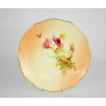 A Royal Worcester scallop shaped plate by Edward Raby, circa 1905, painted with flowers, moth and