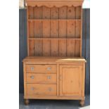 A Victorian pine dresser, 116cm wide by 45cm by 196cm high