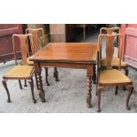 A 1950s oak extending dining table and chairs. 90cm by 90cm
