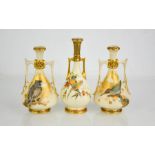 A garniture of three Royal Worcester twin handled vases, of Persian design, painted with birds on an