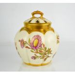 A Royal Worcester pot pourri vase with inner cover and outer cover painted with flowers, on an ivory