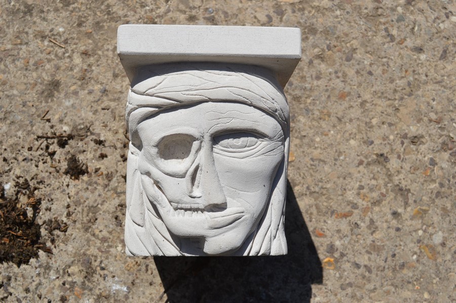 A hand-carved Portland stone corbel "my mortarium" carved by local artist Timothy Ennis