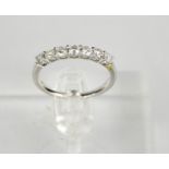 A 9ct white gold and diamond seven stone ring, 0.62ct total diamond weight, size M, 2g.