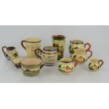 A quantity of Torquay ware to include mug, miniature jugs and vase etc