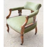 An Edwardian mahogany chair upholstered in green velour