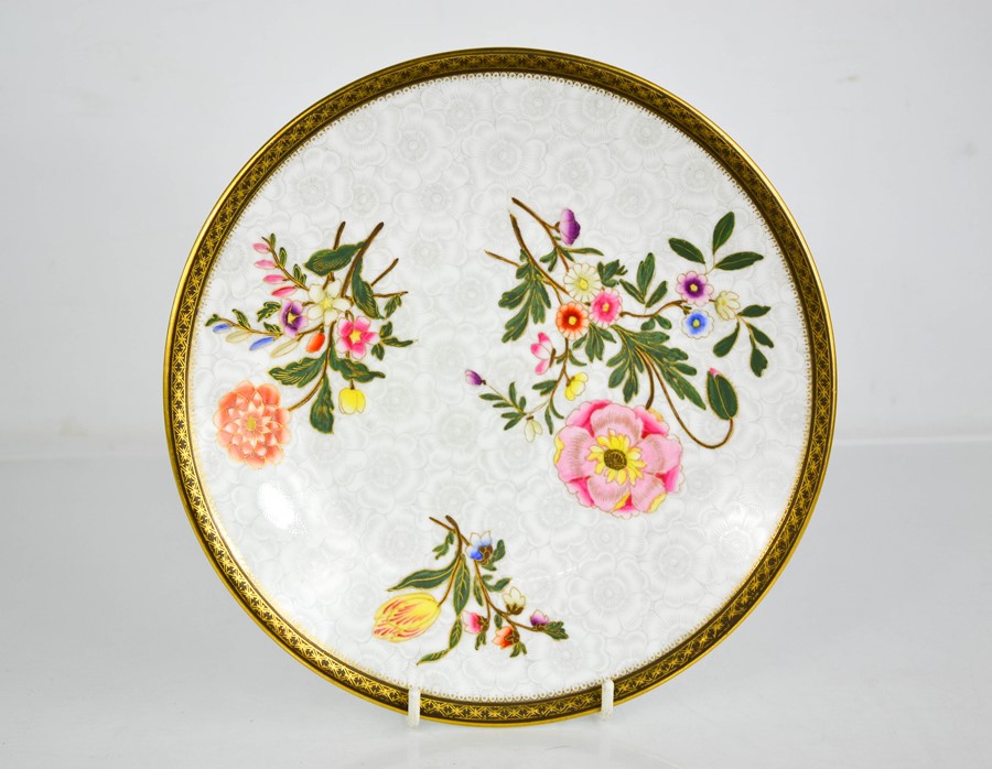 A Royal Worcester plate decorated with sprays of flowers, with a grey floral background, 23cm