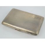 A silver cigar case, machine engraved and monogrammed, 5.76toz.