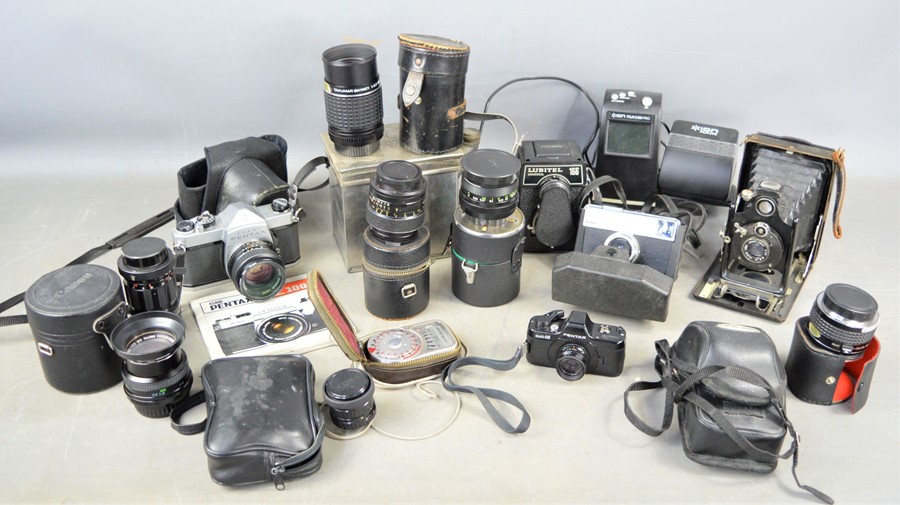 A group of vintage cameras and lens and accessories to include ICA Dresden folding camera, Asahi