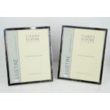 A pair of Carrs sterling silver picture frames to fit a 25 by 20cm photo