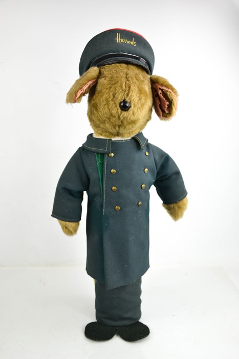 A Harrods bear, complete with uniform and hat, early 20th century.