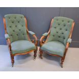 A pair of 19th century William IV mahogany chairs, with scroll arms, serpentine seat fronts,