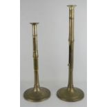 Two ceremonial candlesticks with height adjustable wax ejection levers, 56cm