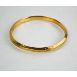 A 9ct gold bangle, 13.26g.