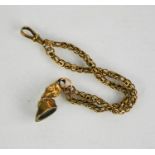 A 9ct gold [tested as] pocket watch chain with horse hoof charm, 10.42g. a/f