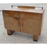A Mid-century sideboard with two drawers above two cupboard doors, 121cms long x 51cms deep x