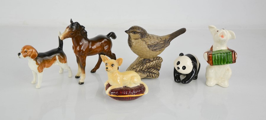 A group of Beswick animal figures to include foal, bird, panda cub, dog and chihuahua.