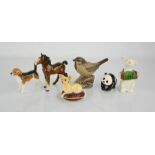 A group of Beswick animal figures to include foal, bird, panda cub, dog and chihuahua.