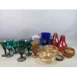 A quantity of vintage glass ware to include smokey glass part dressing set, green glasses and art