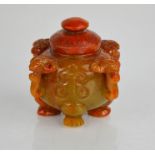 A Chinese heitian jade hand carved jar and cover with rams head handles.