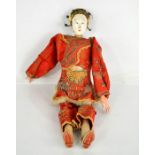 A 19th century Japanese geisha doll in original embroidered clothing.