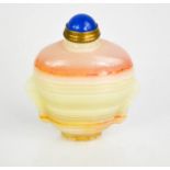A Chinese agate hand carved snuff bottle with metal mount and blue stone stopper.
