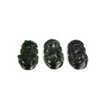 Three Chinese black jade hand carved pendants.