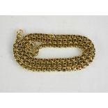 A yellow metal chain link necklace [tested as 9ct gold], 11.38g.