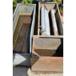 A quantity of cast iron and galvanised animal troughs.
