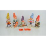 A group of five Goebel figurines to include Ed the Wine Cellar Steward, Mark the Swimmer, Robby