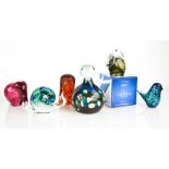 A group of glass paperweights of various form, to include Mdina and Caithness examples.