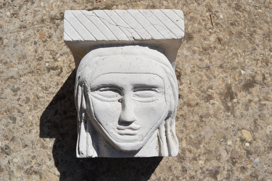 A hand-carved Portland stone corbel depicting a nuns head, carved by local artist Timothy Ennis