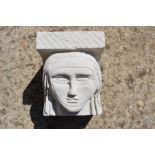 A hand-carved Portland stone corbel depicting a nuns head, carved by local artist Timothy Ennis