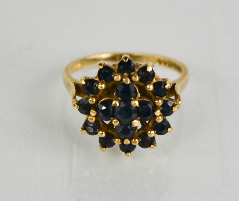 A 9ct gold and garnet set cluster ring.