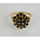 A 9ct gold and garnet set cluster ring.
