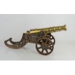 A 19th century signal cannon in a cast iron frame