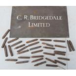 A group of Scholey of Sheffield letter punches and a C.R Bridgedale limited metal sign