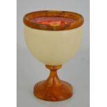 A vintage ostrich egg chalice on a wooden base, silk lining.