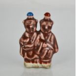 A Chinese twin figure glazed pottery snuff bottle.