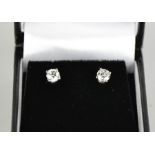 A platinum and diamond pair of stud earrings, 0.8ct diamond total, HVS2 with GIA certificates.