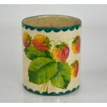 A Wemyss pottery mug, painted with strawberries and signed to the base, 9cm high.