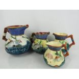 Four graduated fish jugs including Staffordshire examples