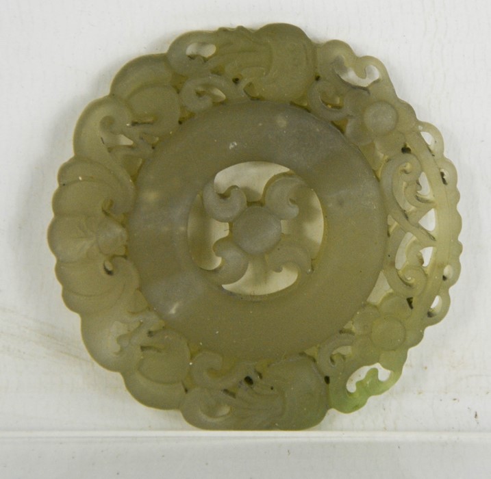 A Chinese Heitian green jade hand carved double sided pendant.