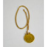 A 9ct gold chain and guinea pendant dated 1790, 11.48g.
